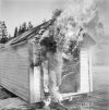 In 1957, Matti Jämsä tested the asbestos suit belonging to Suomen Mineraali. He remained in the flames for so long that the assistants began to fear for the worse. Photo: UA Saarinen / Press Photo Archive JOKA / Finnish Heritage Agency. Objektinumero: JOKAUAS2_3728:9