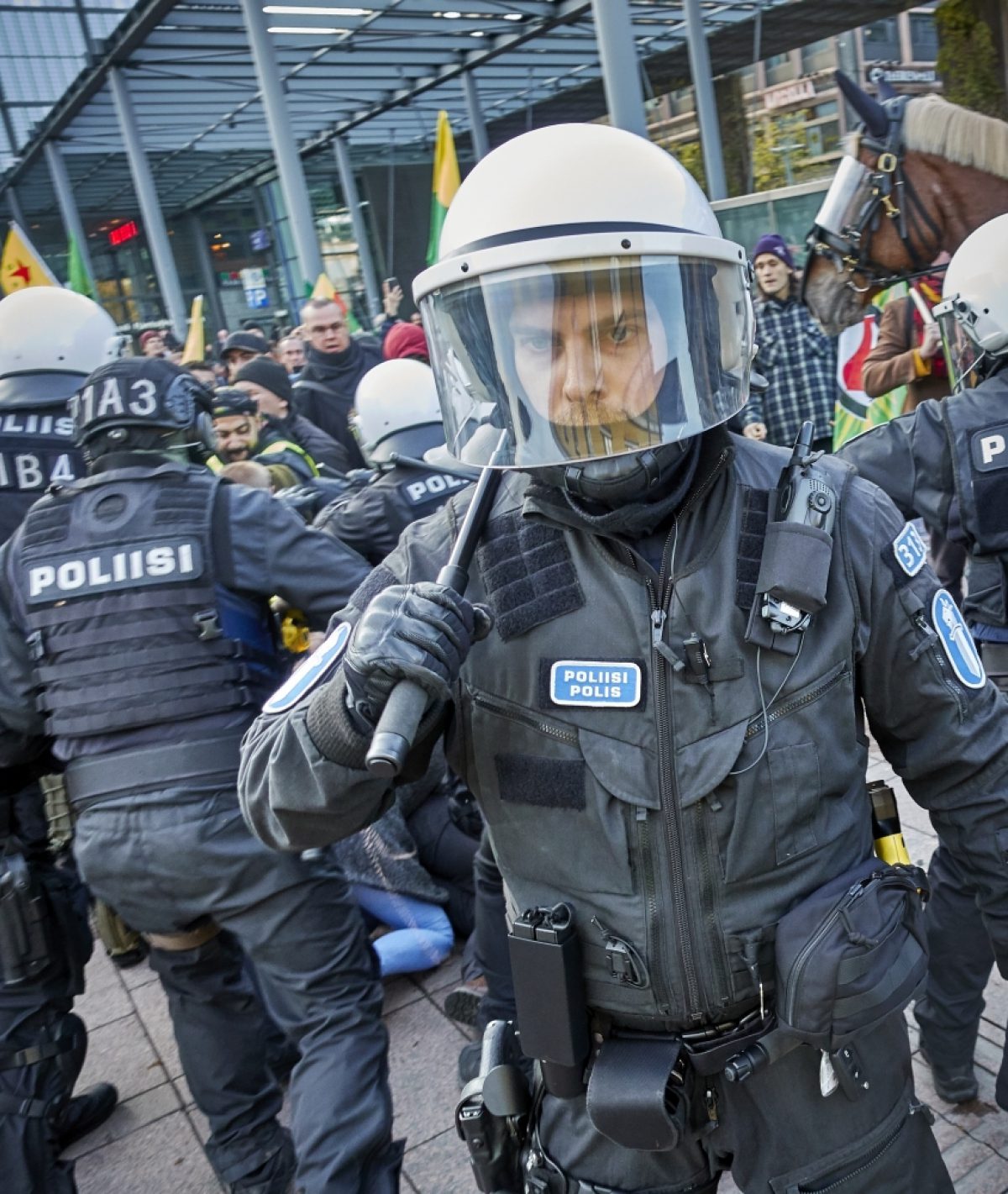 Documentation of the Turkey out of Rojava demonstration in Helsinki on 19 October 2019 (cropped detail). Police at a demonstration against the Turkish military action in the autonomous Kurdish region. Photo: Hannu Häkkinen / Finnish Heritage Agency