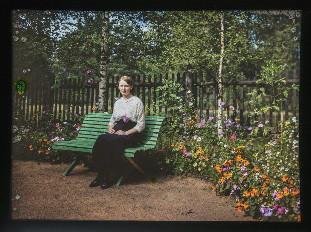 Helka, sister of Reino Pietinen, among a profusion of flowers. Photo: Reino Pietinen / Picture Collections of the Finnish Heritage Agency